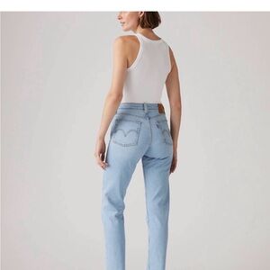 Levi’s Wedgie sz 32, button fly, ankle length, raw hems, cotton blend, pale blue